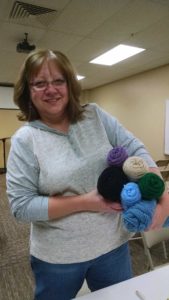 photo of volunteer with yarn