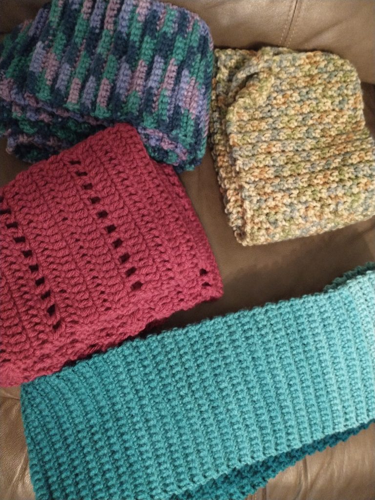 4 scarves set out next to each other